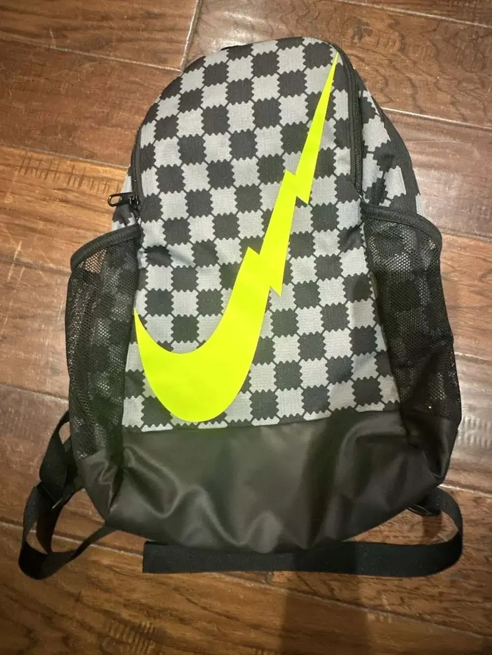 Nike Brasilia JDI Kids' Mini Backpack in Black/Grey Checkered with Volt Swoosh